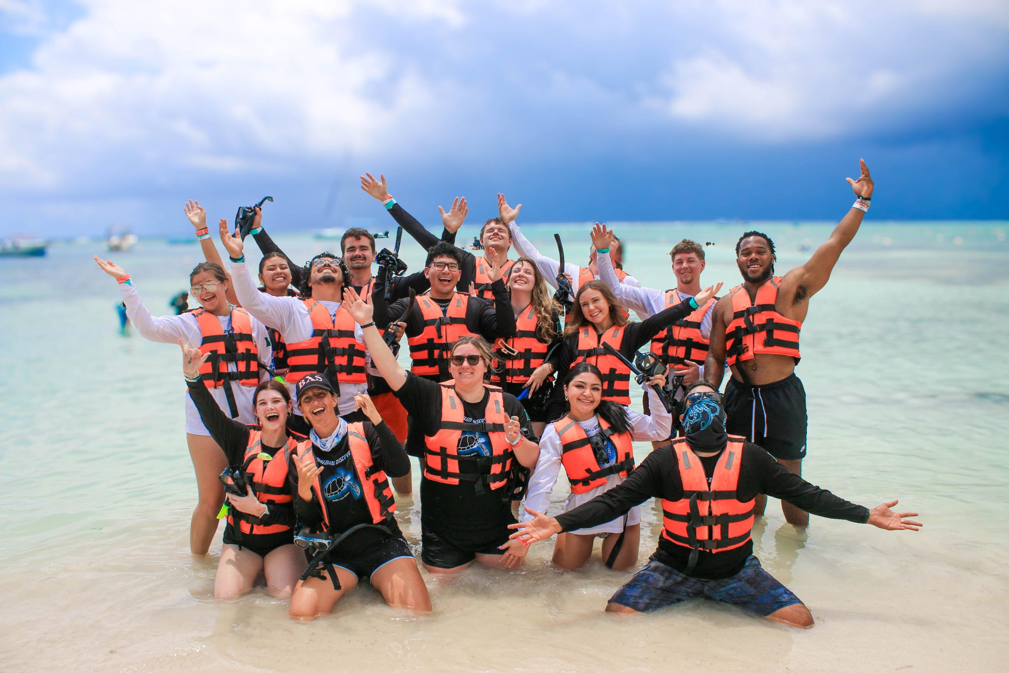 Team celebrating in the ocean